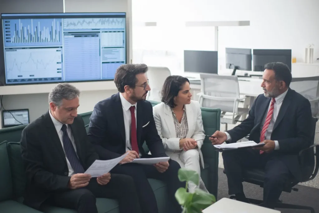 Four people working in the office