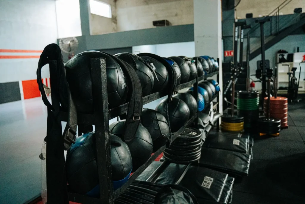 Modern indoor gym with kettlebells and equipment
