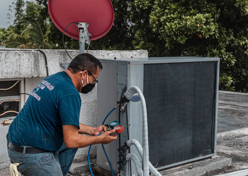 Man checking an air conditioner