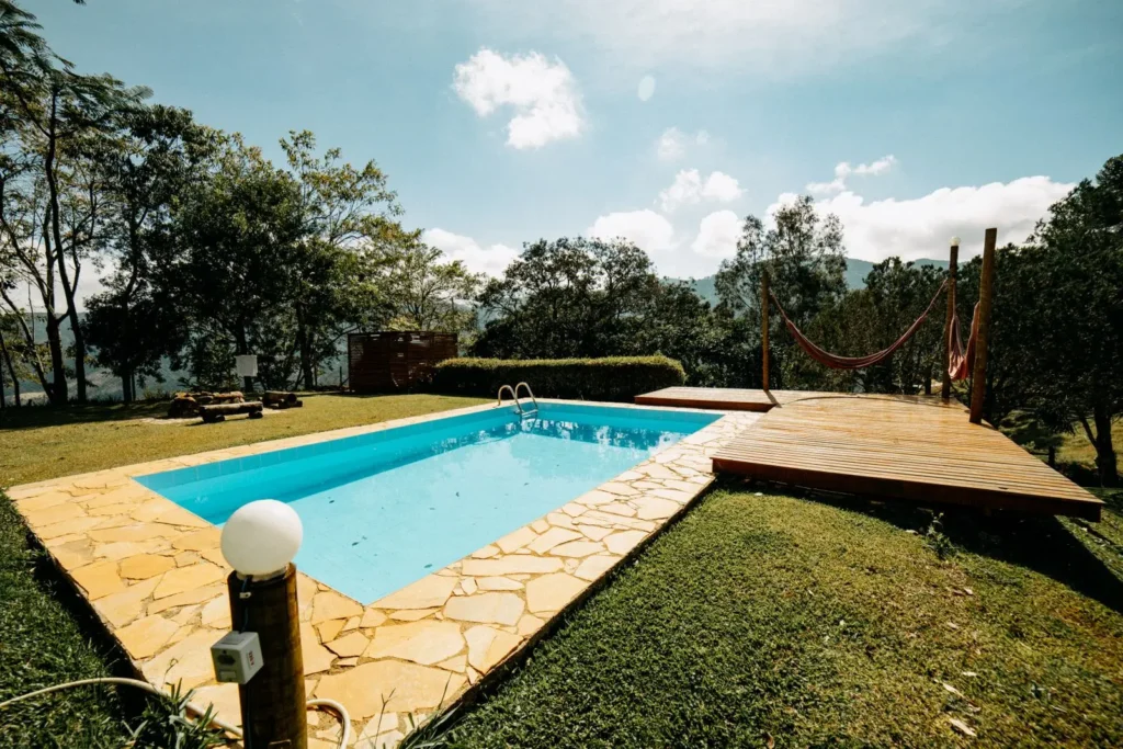 A swimming pool on a grassy field